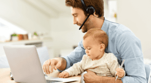 Man and baby working at computer